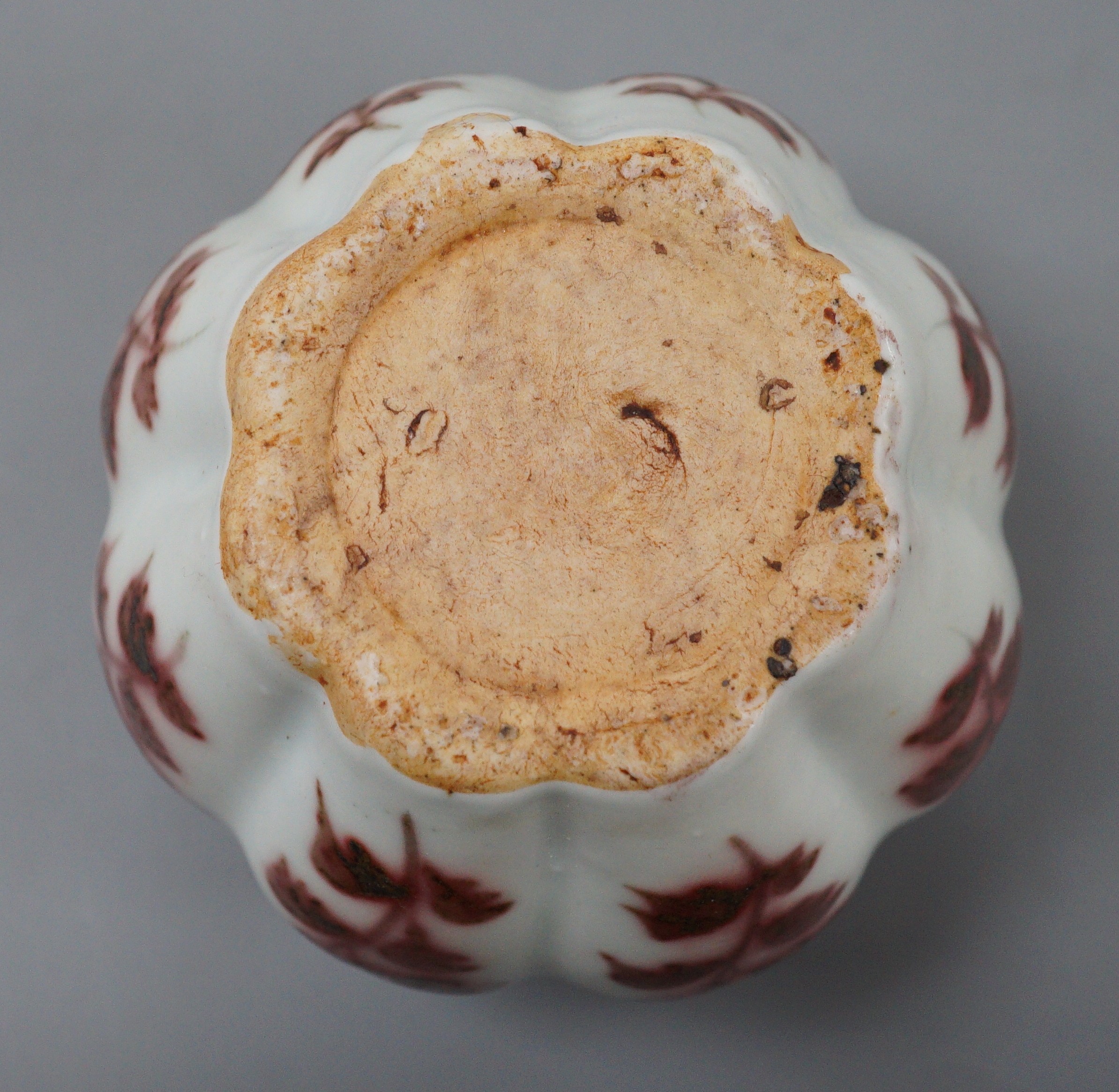 A Chinese underglaze copper red lobed jar, 9cm tall